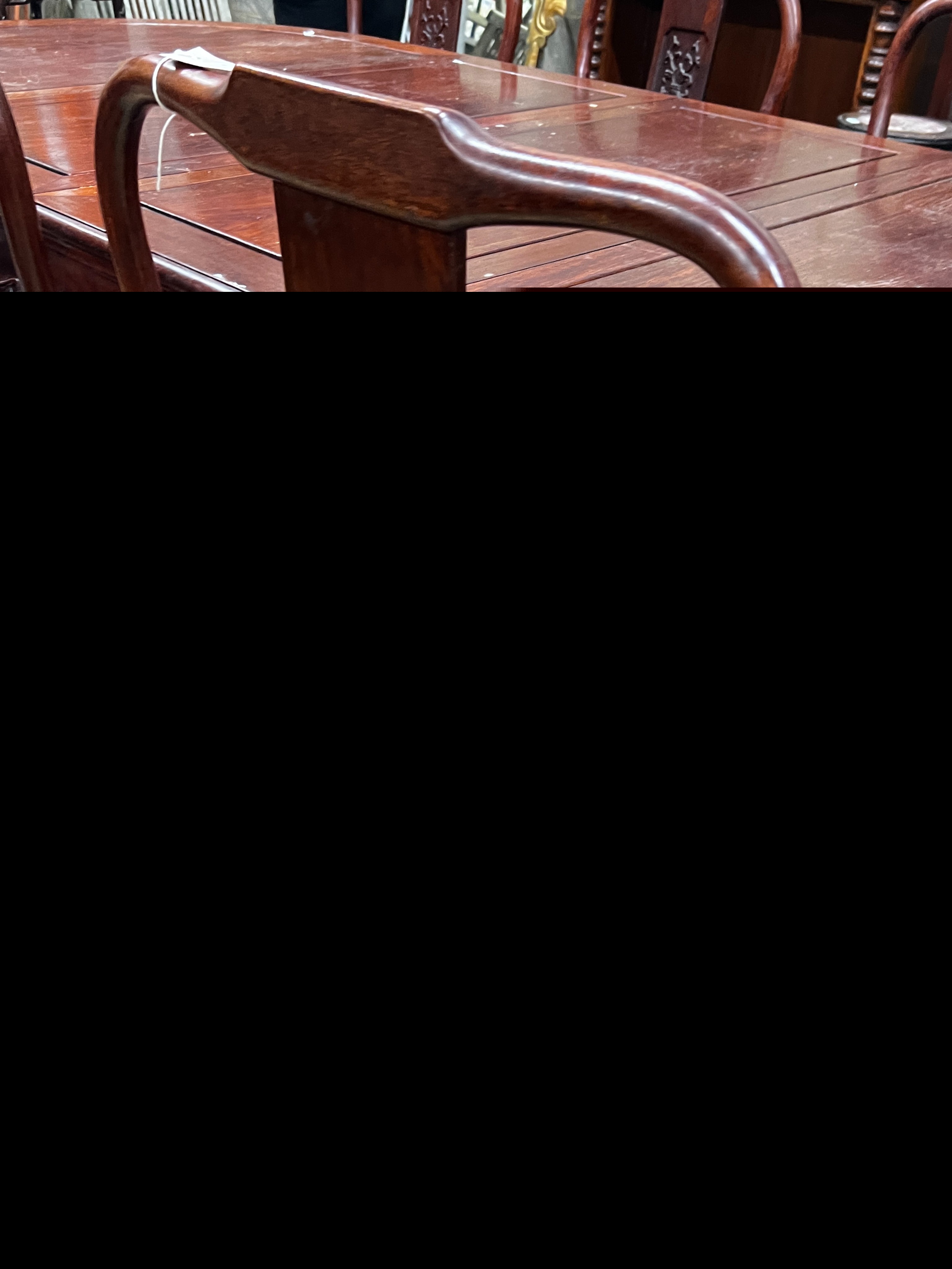 A Chinese hardwood extending dining table, length 244cm extended, two spare leaves, width 110cm, height 78cm and six chairs (2 with arms)